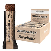 Barebells protein bars caramel cashew box with multiple wrapped bars and one unwrapped nut coated bar
